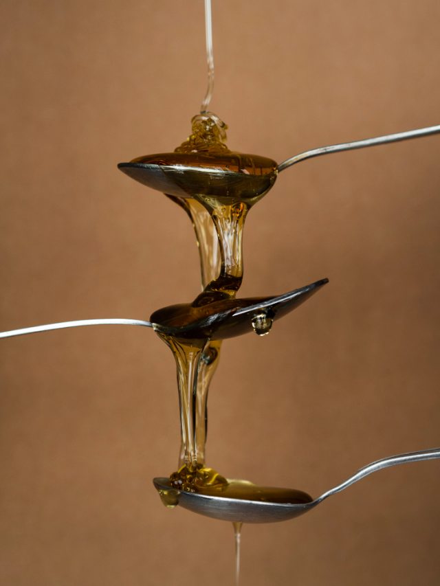 METAL SPOONS WITH HONEY